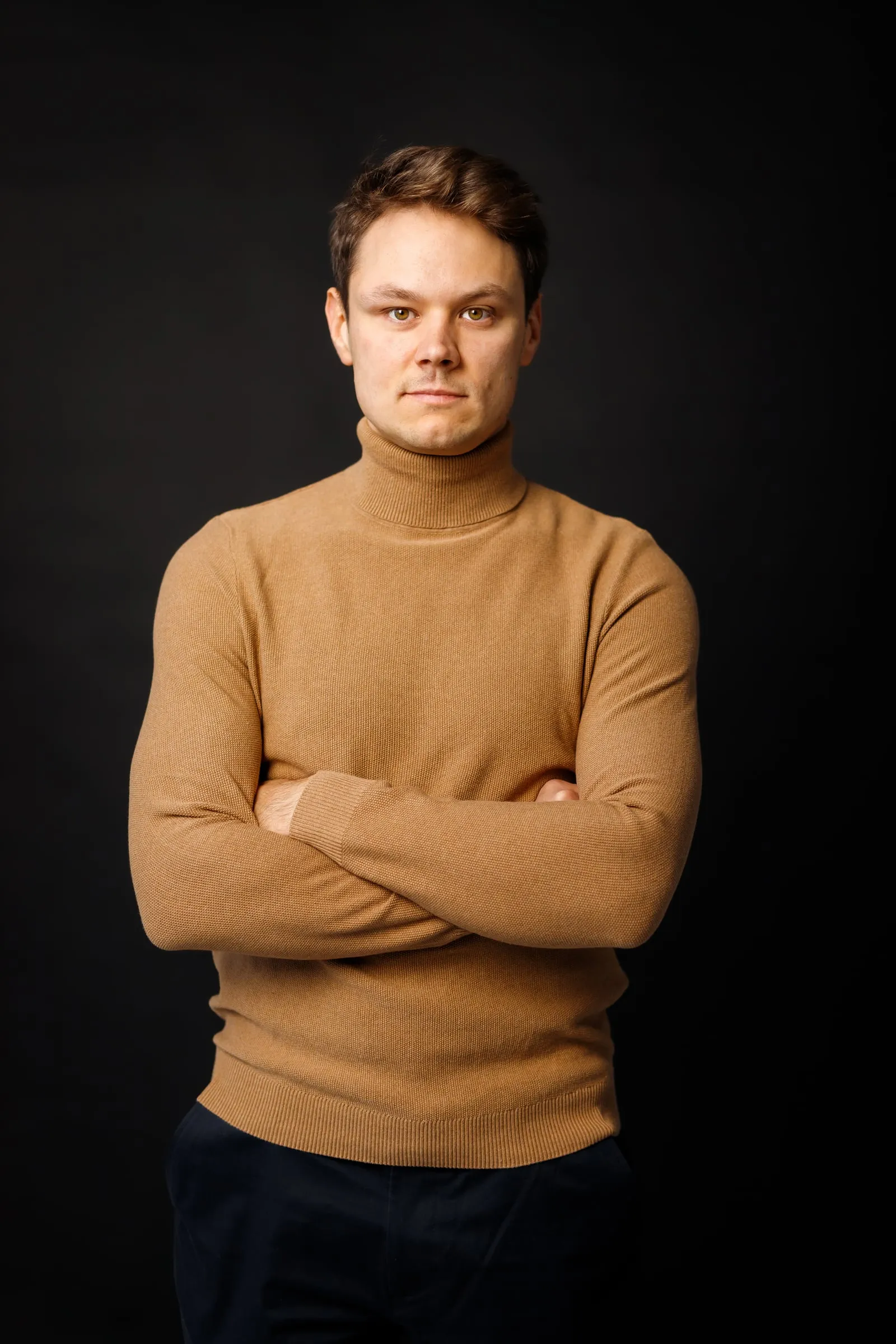 Portrait of Martins Kokins, founder of MK Design, with arms crossed
